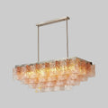 Side View of Illuminated Modern Pink-Amber Faceted Glass Linear Chandelier