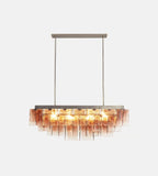 Front View of Illuminated Modern Cascading Art Glass Linear Chandelier