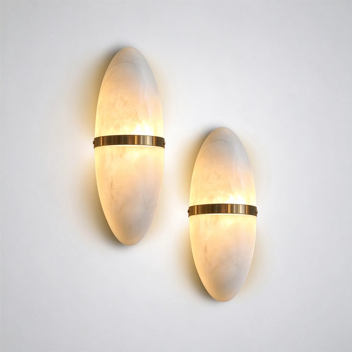 Illuminated Modern Oval Alabaster Wall Sconce Pair Studio Shot on White Background