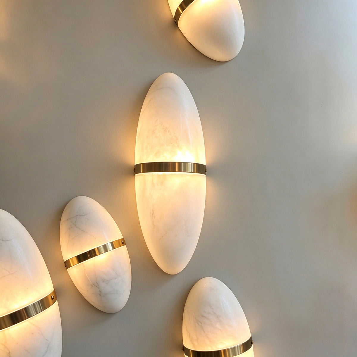Modern Brass Alabaster Wall Sconce Cluster Display on Interior Wall