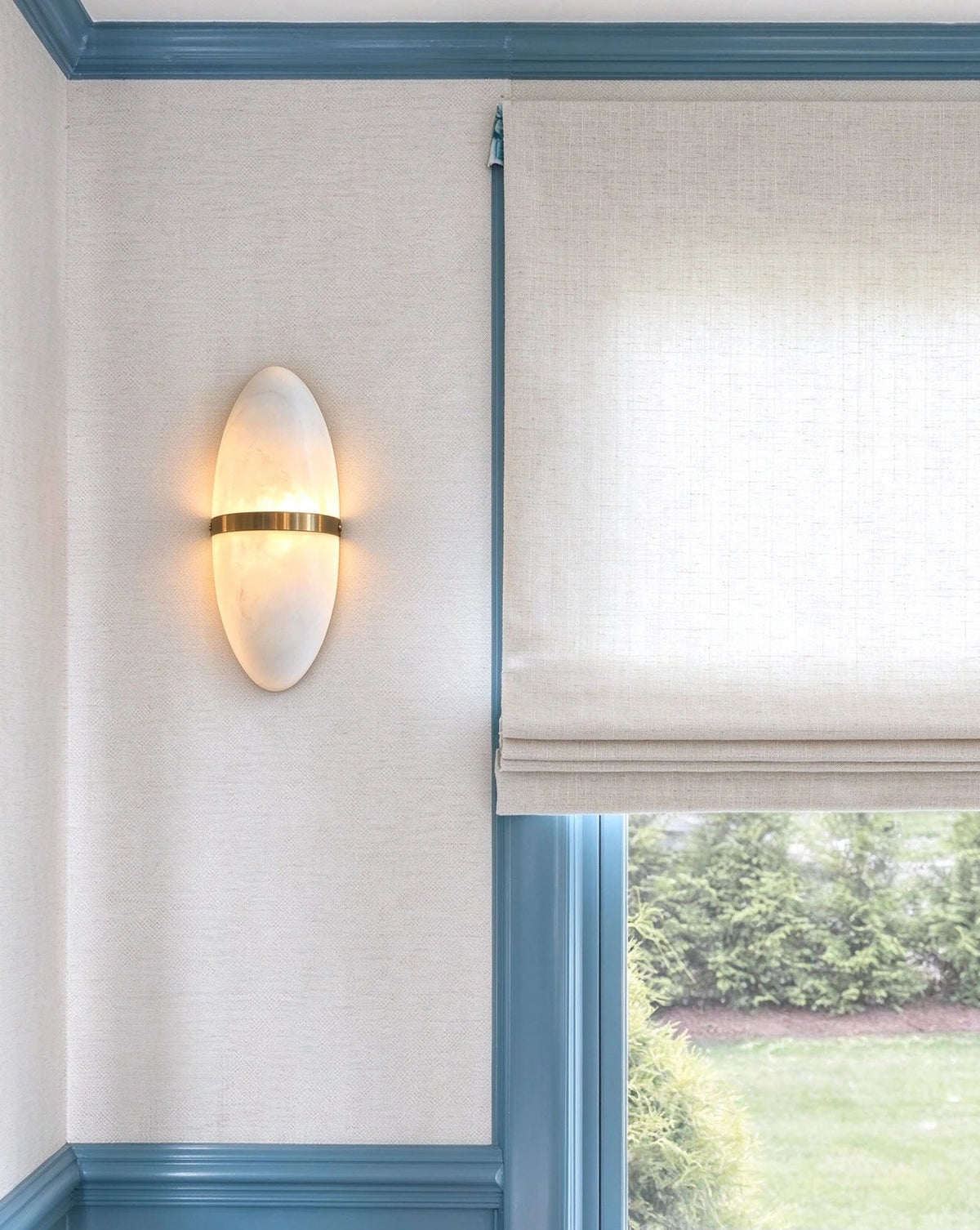 Modern Oval Alabaster Wall Sconce in Bright Interior Setting