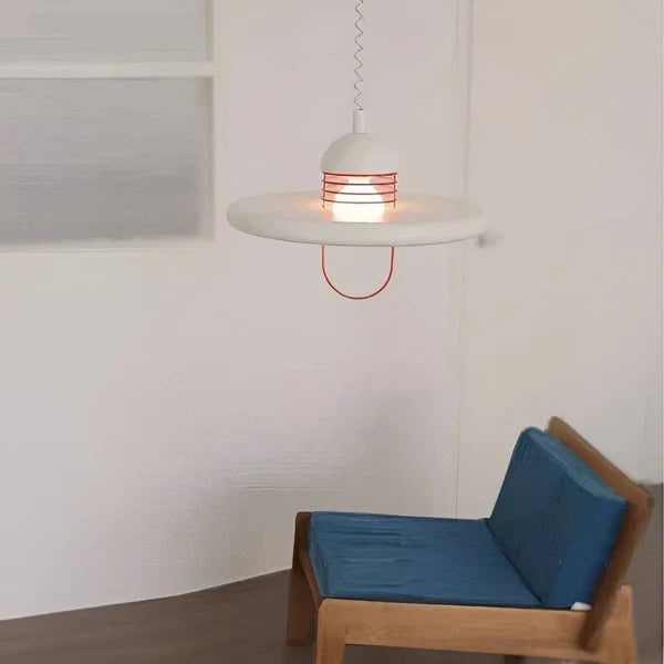 Modern White Disc Pendant Light Over Living Room Corner