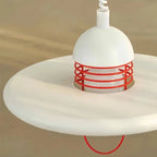 Top Angled View of Illuminated Modern White Disc Pendant Light