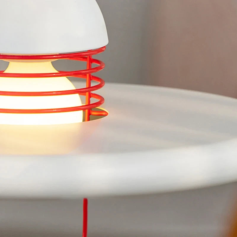 Close Up View of Red Accent Lines and White Disc Shade