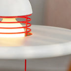 Close Up View of Red Accent Lines and White Disc Shade