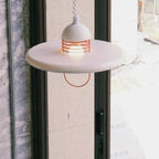Illuminated Modern White Disc Pendant Light Studio Shot