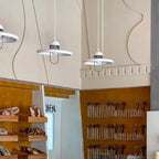 Modern White Disc Pendant Lights in Retail Store Display