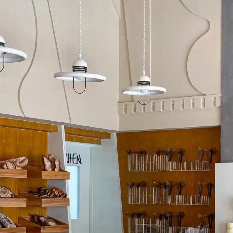 Modern White Disc Pendant Lights in Retail Store Display