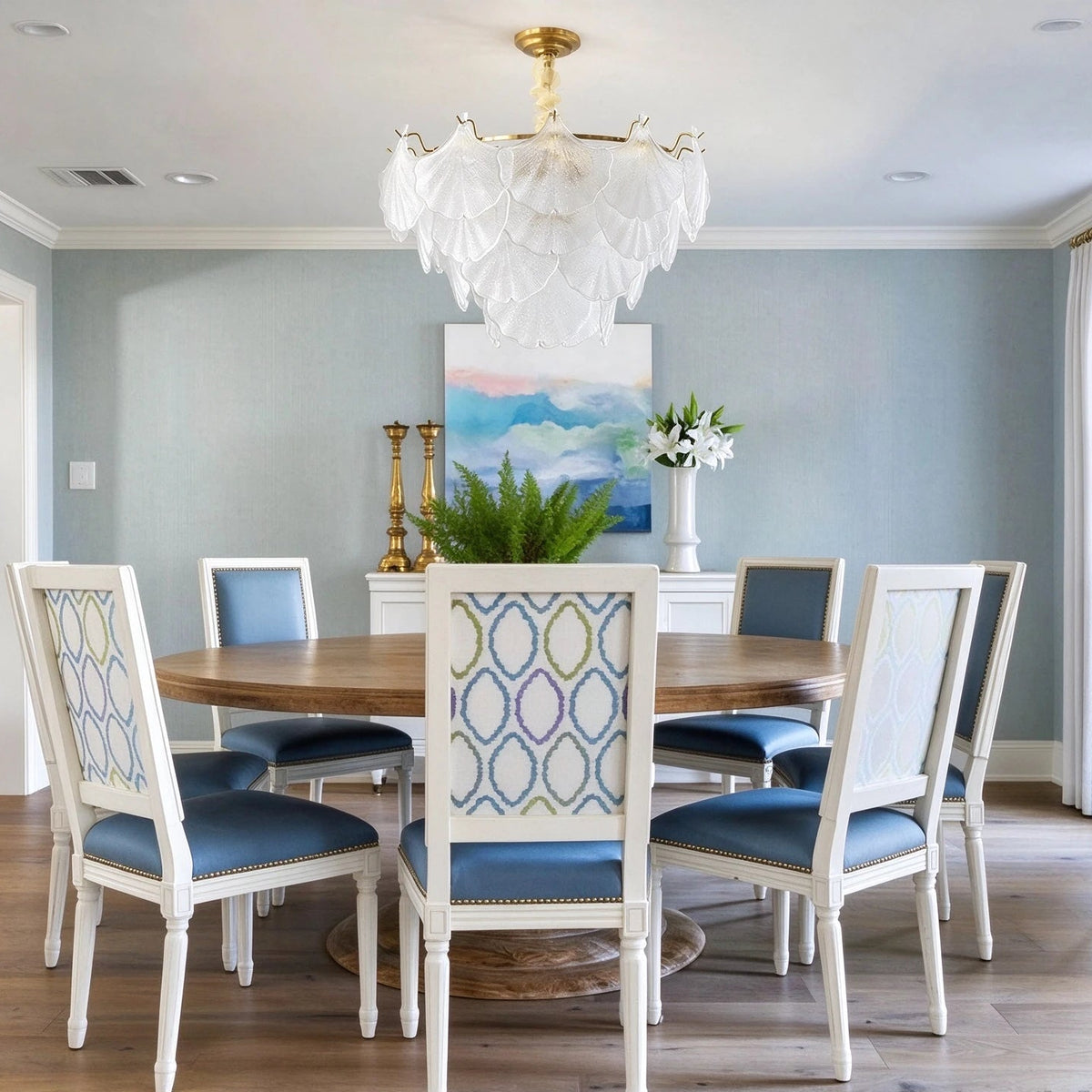 Modern Brass Shell Chandelier Over Round Dining Table