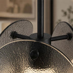 Close Up View of Modern Brass Frame and Layered Wave Disc Glass Connection Details