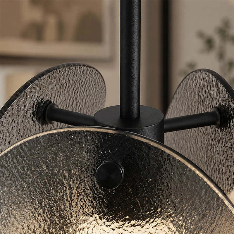 Close Up View of Modern Brass Frame and Layered Wave Disc Glass Connection Details