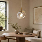 Modern Brass Layered Wave Disc Pendant Light in Stylish Dining Area