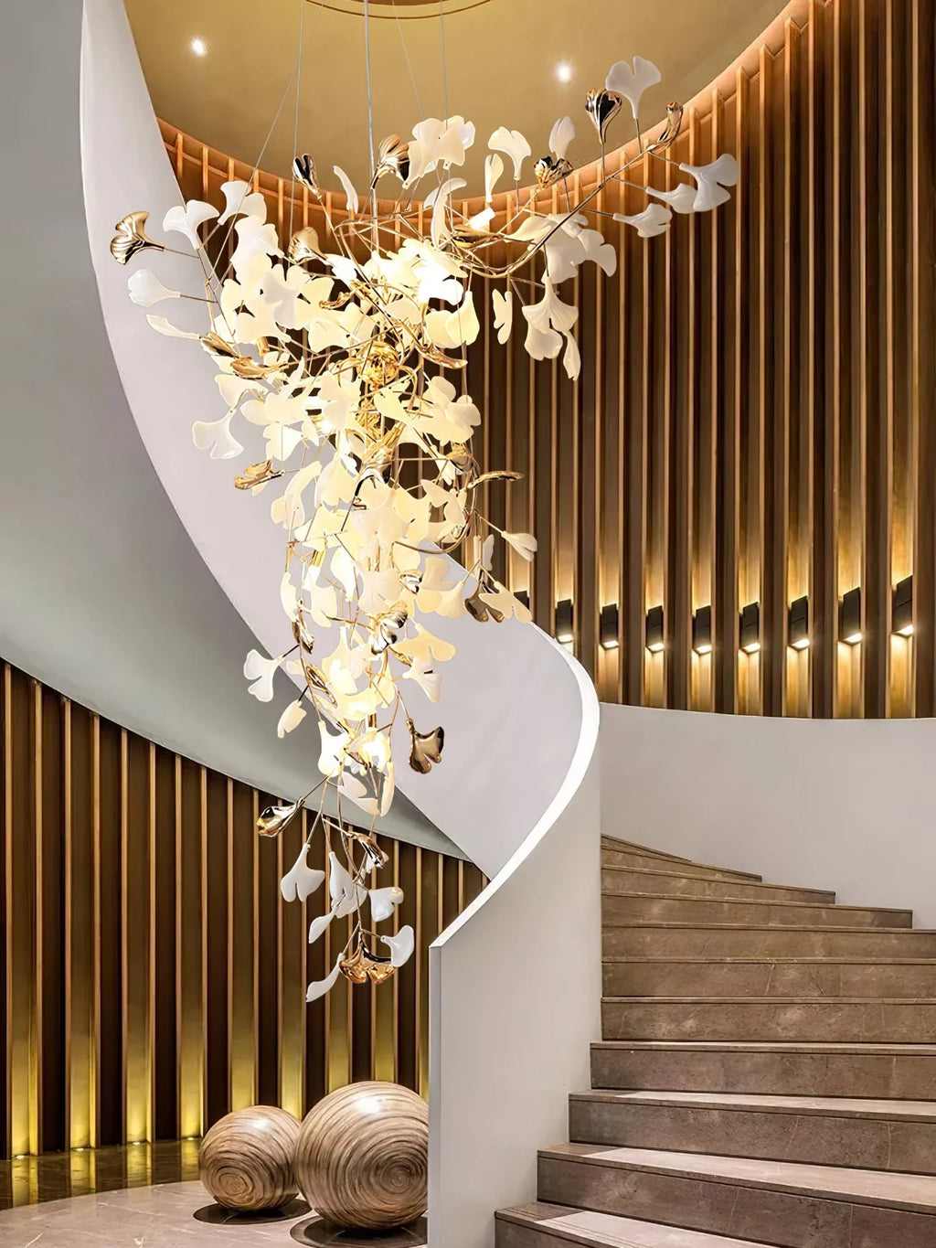 Modern Grand Gold Branch Chandelier Along Curved Stairway