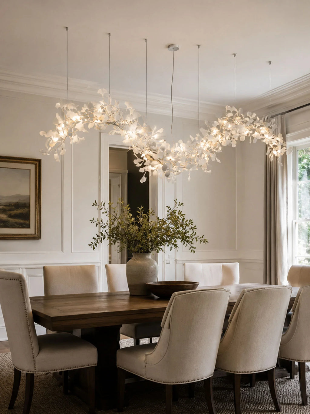 Modern Linear Ginkgo Leaf Chandelier Over Dining Room Table