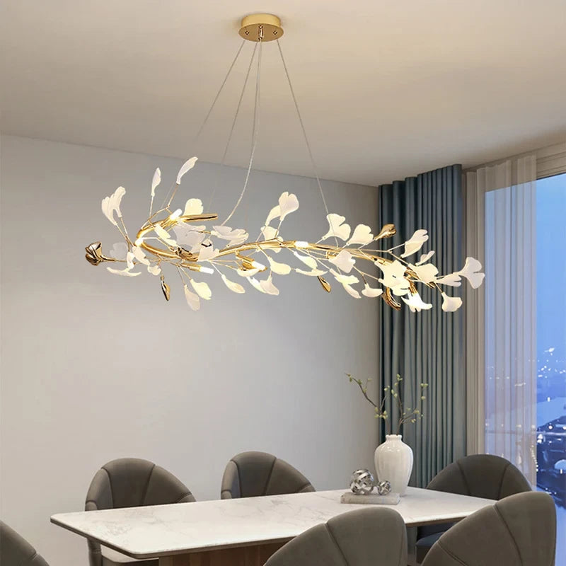 Modern Gold Ginkgo Leaf Oval Chandelier Over Dining Table