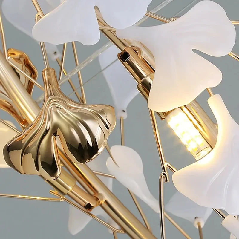 Close Up View of Gold Branch Frame and White Ginkgo Leaf Glass Shade