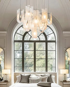 Modern Multi-Light Glass Chandelier in Master Bedroom Setting