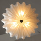 Bottom View of Glowing Scalloped Glass Ceiling Light