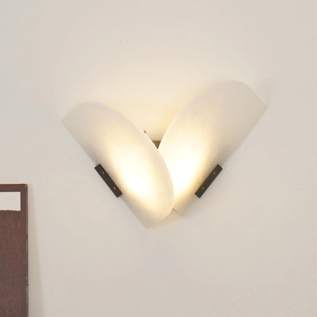 Glowing V-Shape Alabaster Sconce Mounted on Neutral Wall