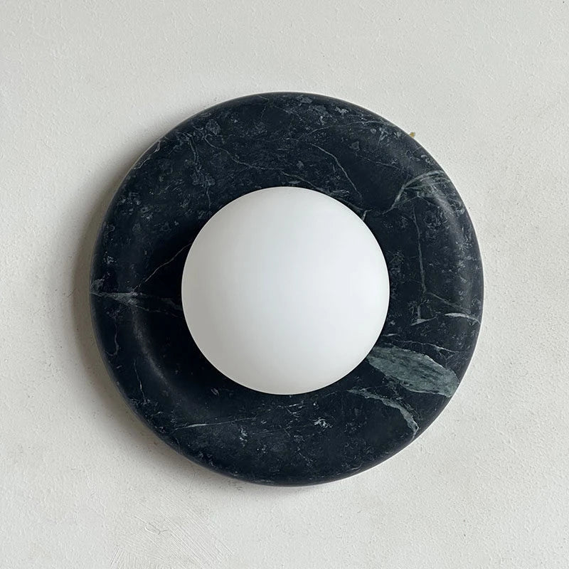 Illuminated Modern Black Marble Round Disc and Globe Wall Sconce Studio Shot