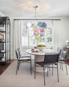 Modern Multi-Color Disc Chandelier Over Round Dining Table