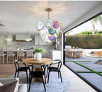 Modern Gradient Disc Art Glass Chandelier Over Kitchen Dining Area