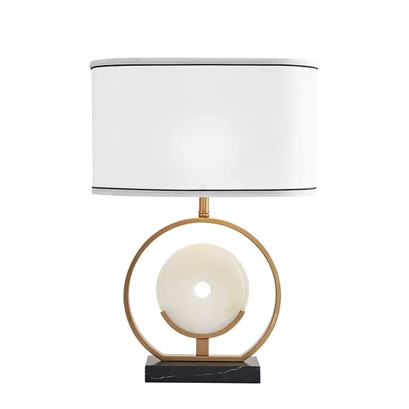 Modern Brass Ring and Alabaster Disc Table Lamp with Oval Fabric Shade and Black Marble Base on Pure White Background