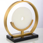 Illuminated Modern Brass Ring and Alabaster Disc Table Lamp Studio Shot on Pure White Background