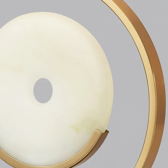 Close Up View of Illuminated Alabaster Disc and Brass Ring Structure Details