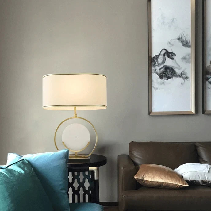Modern Brass Ring and Alabaster Disc Table Lamp in Cozy Living Room
