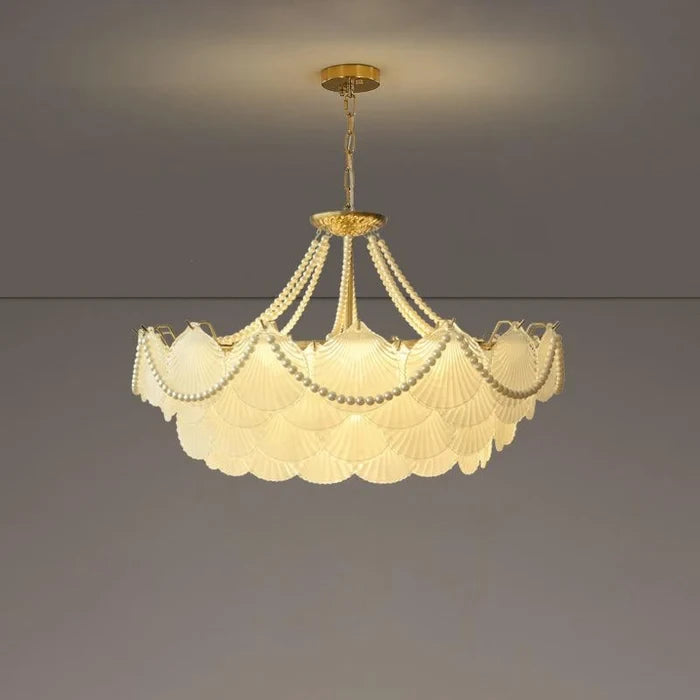 Illuminated Modern Brass Beaded Shell Art Glass Chandelier Studio Shot