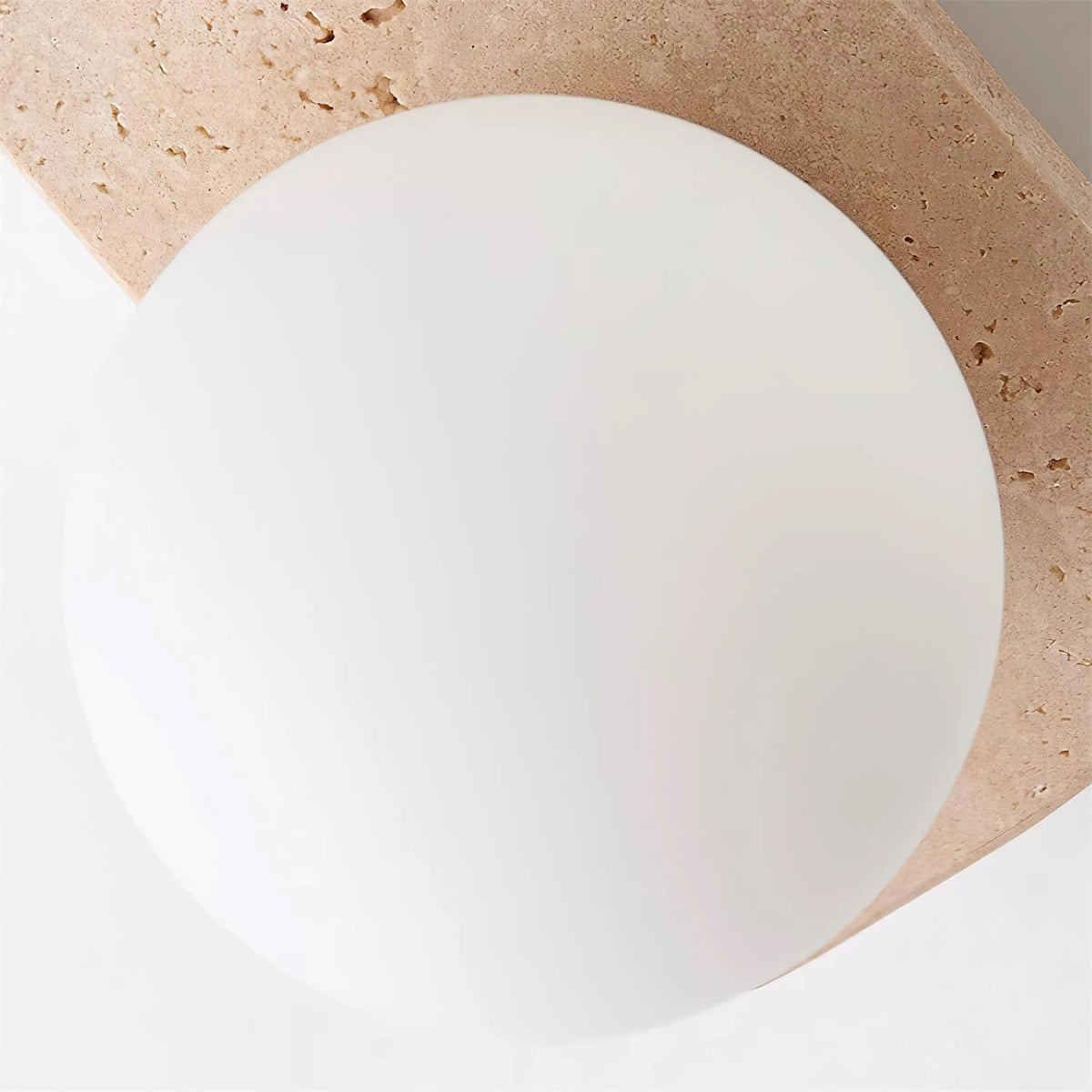 Detail View of Frosted Opal Glass Globe Shade on Travertine Base