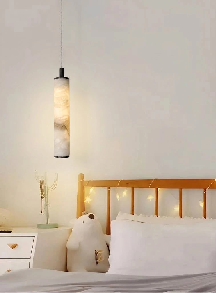 Modern Cylindrical Alabaster Pendant Light Over Bedside