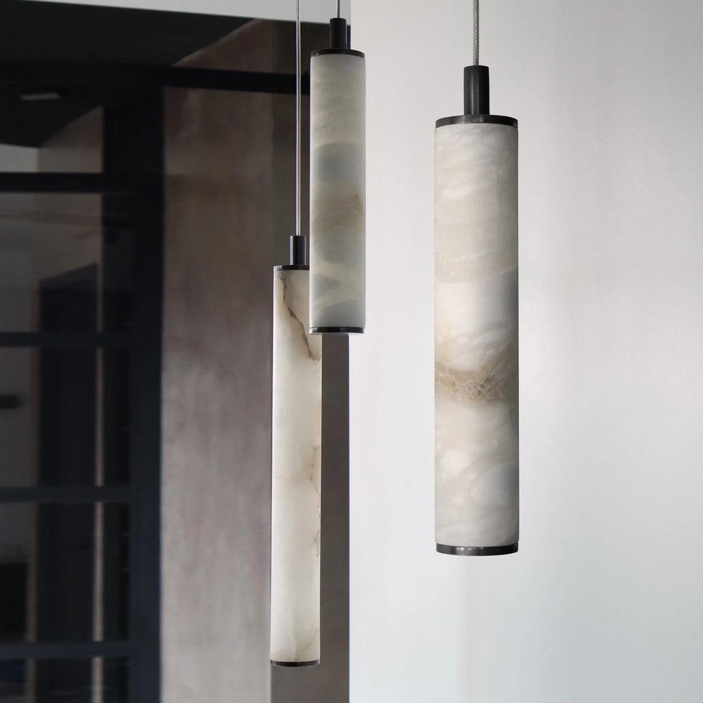 Angled View of Illuminated Modern Cylindrical Alabaster Pendant Light