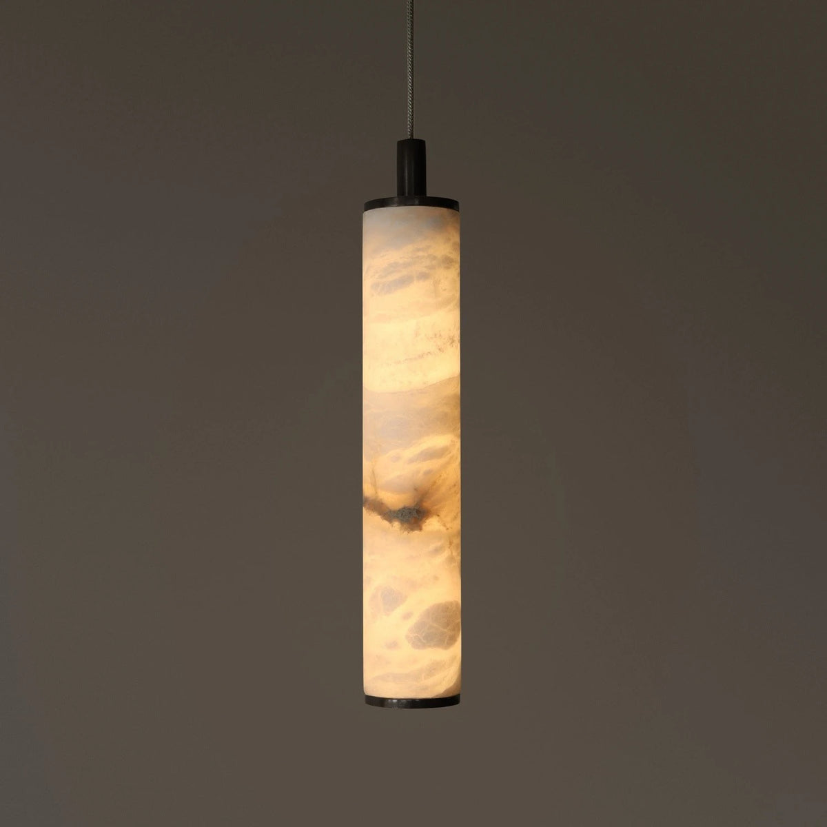Illuminated Modern Cylindrical Alabaster Art Glass Pendant Light in Dark Studio