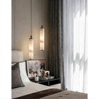 Modern Cylindrical Alabaster Pendant Light Over Bedroom Nightstand