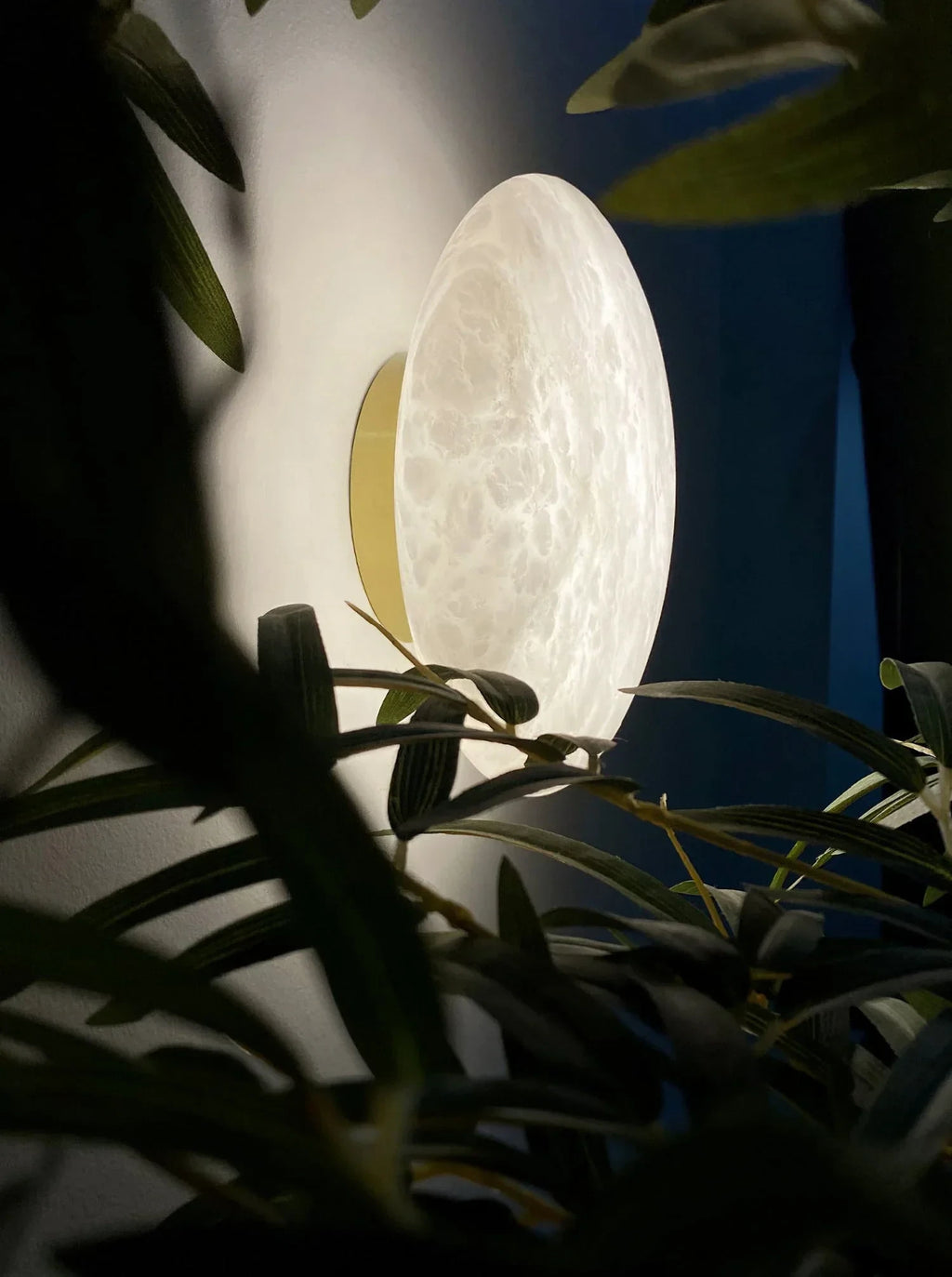 Illuminated Modern Oval Alabaster Art Glass Wall Sconce with Greenery Display
