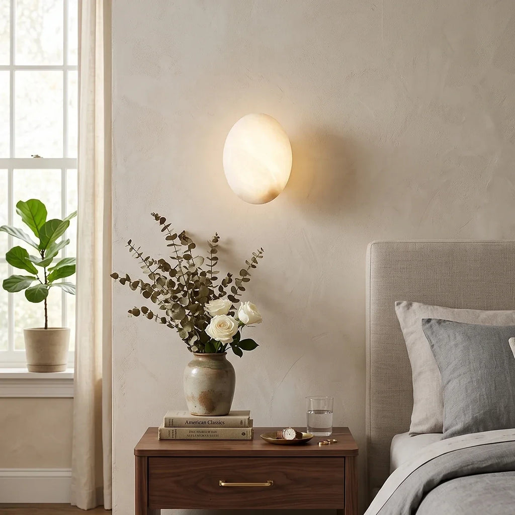 Modern Oval Alabaster Wall Sconce in Master Bedroom Setting