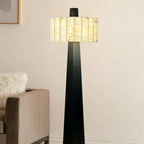Alabaster Drum Floor Lamp Over Living Room Armchair