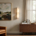Illuminated Modern Alabaster Wall Sconce in Cozy Living Space