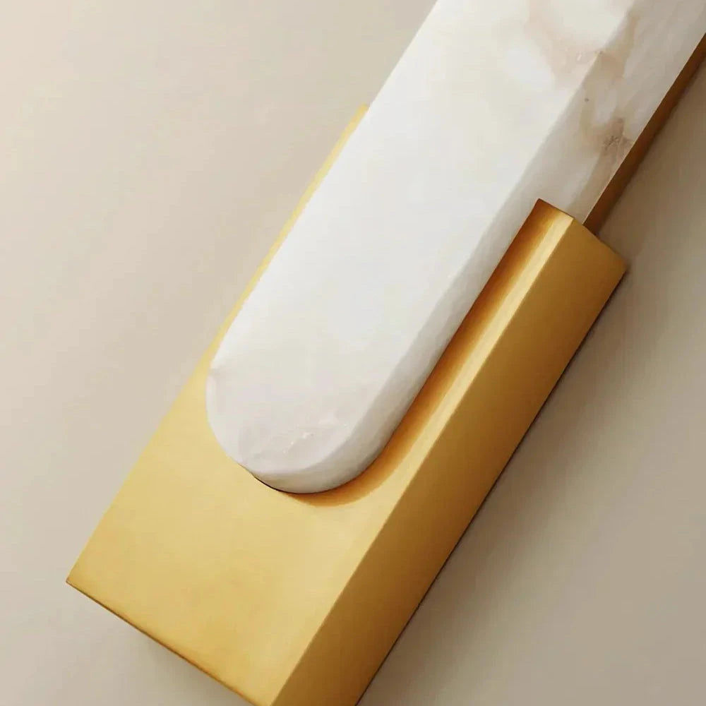 Close Up View of Curved Alabaster Stone and Brass Mounting Base
