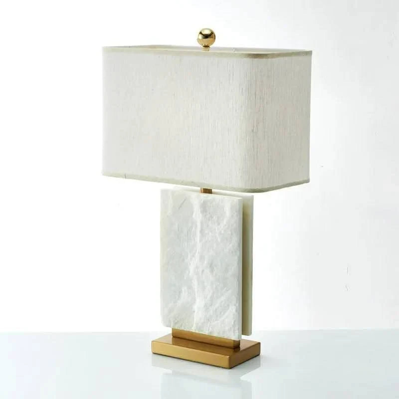 Illuminated Modern Brass Textured Marble Table Lamp Studio Shot on Pure White Background