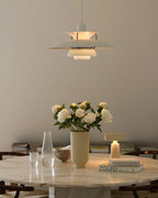 Modern Nordic Pendant Light Over Round Table with Floral Decor