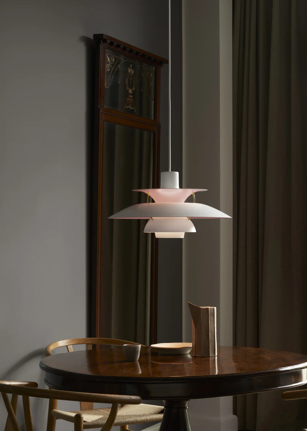 Modern Nordic Pendant Light Over Round Dining Table in Elegant Setting