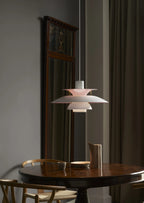 Modern Nordic Pendant Light Over Round Dining Table in Elegant Setting