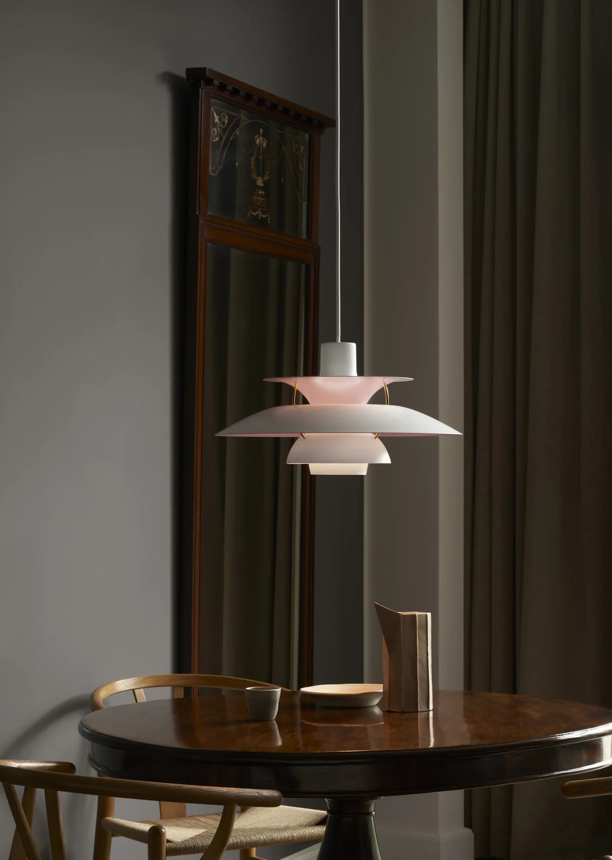 Modern Nordic Pendant Light Over Round Dining Table in Elegant Setting