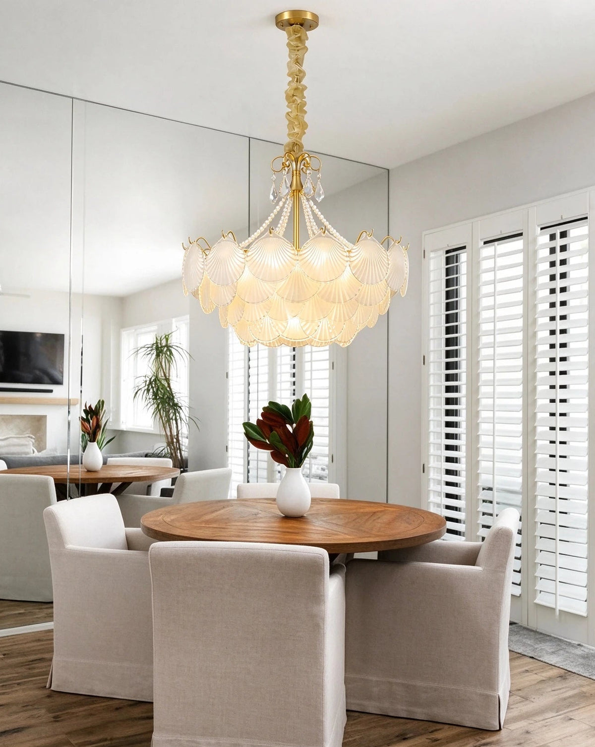 Modern Shell Art Glass Chandelier Over Round Dining Table