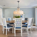 Modern White Flower Chandelier Over Round Dining Table
