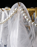 Close Up View of Brass Frame and Pearl String Connection Structure