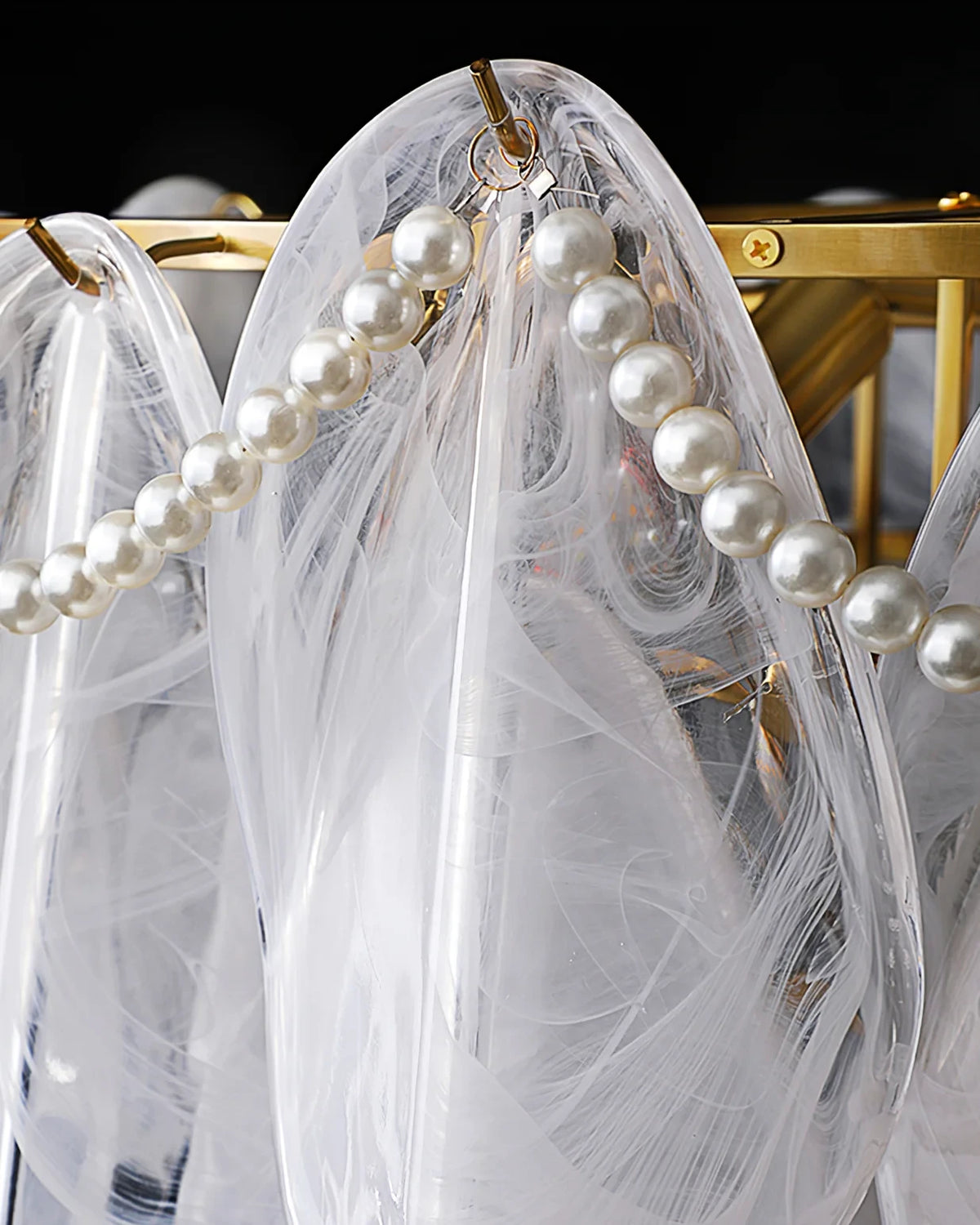 Close Up View of Brass Frame and Pearl String Connection Structure